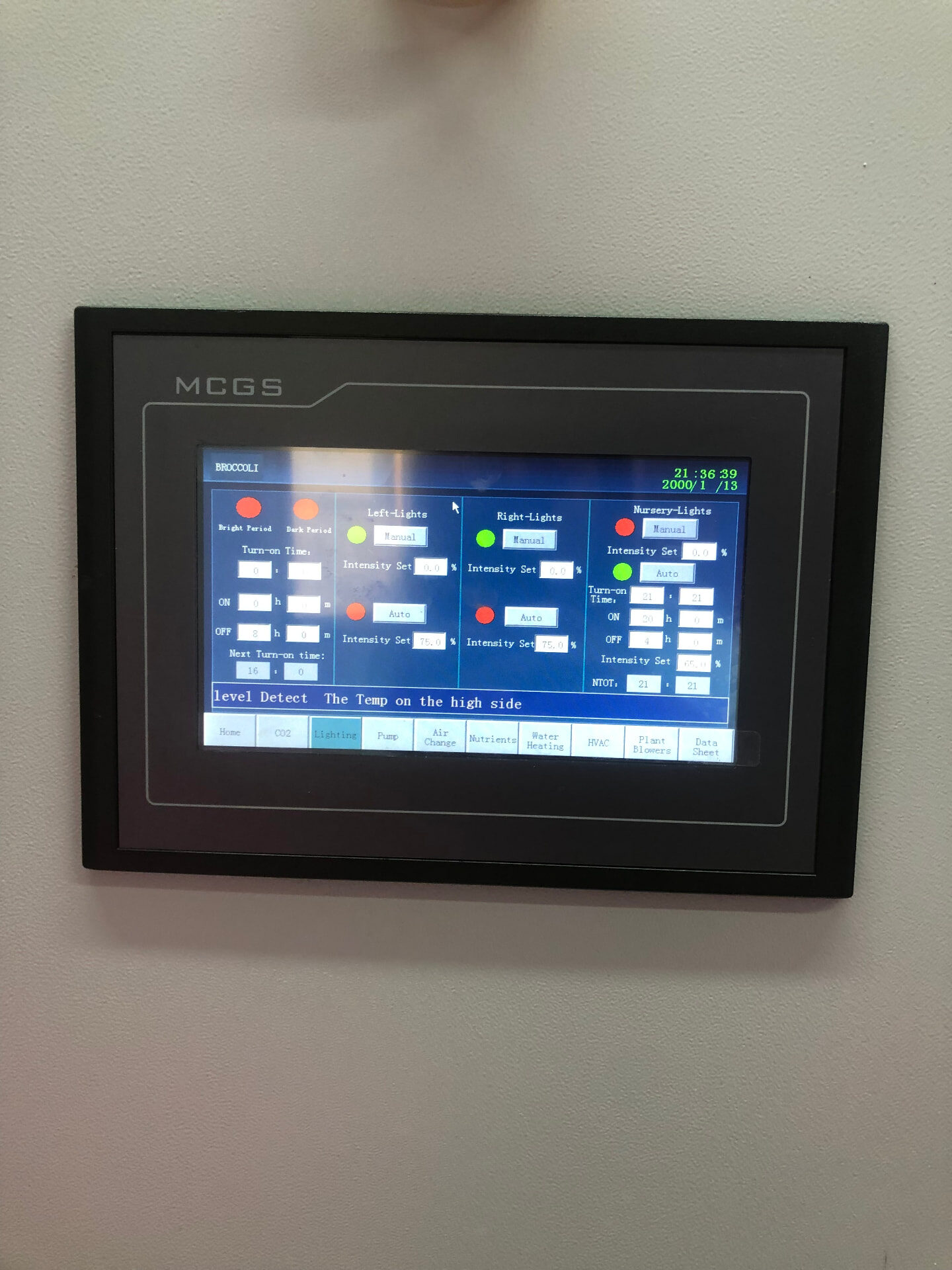 Wall-mounted PLC touchscreen showing the lighting schedule of the crop recipe